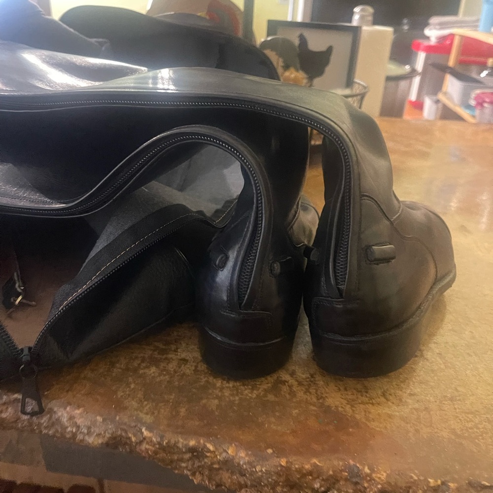 Riding boots with bags and straps